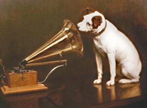 Ilustración clásica de un perro escuchando un gramófono, conocida como La voz de su amo